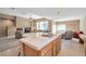 Kitchen island with cooktop, an open floor plan that leads to a living area, and recessed lighting at 129 Sapodilla Ln, Las Vegas, NV 89144