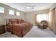 Large bedroom with a comfortable sitting area at 129 Sapodilla Ln, Las Vegas, NV 89144