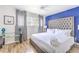 Bright bedroom with a tufted headboard bed, stylish decor, and natural light at 1508 Dorothy Ave # 4, Las Vegas, NV 89119