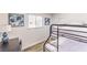 Cozy bedroom with bunk beds, a small desk, and natural light from the window at 1508 Dorothy Ave # 4, Las Vegas, NV 89119