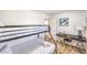 This bedroom features a bunk bed, a desk, and wood flooring, providing a comfortable and functional space at 1508 Dorothy Ave # 4, Las Vegas, NV 89119