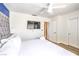 Comfortable bedroom features neutral colors, a ceiling fan, wood-look floors and closet storage for relaxing living at 1508 Dorothy Ave # 4, Las Vegas, NV 89119