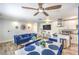 Bright living room and kitchen area with hardwood floors, ceiling fan and white cabinets, blending modern design at 1508 Dorothy Ave # 4, Las Vegas, NV 89119