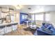 Open living space with modern kitchen, dining area, and cozy blue sofa at 1508 Dorothy Ave # 4, Las Vegas, NV 89119