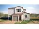 Two-story home featuring stone accents, a red tile roof, desert landscaping and an attached garage at 1808 Mangrove Ct, Las Vegas, NV 89138