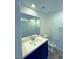 Well-lit bathroom featuring modern vanity, white quartz countertop and ample storage at 20 Barbara Ln # 47, Las Vegas, NV 89183