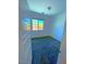 A clean bedroom with plush carpeting, a window offering natural light, and a walk-in closet, all painted in a neutral color palette at 20 Barbara Ln # 47, Las Vegas, NV 89183