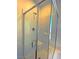 Close-up of the glass-enclosed shower with white tile and built-in seat at 20 Barbara Ln # 47, Las Vegas, NV 89183