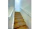 Interior staircase with carpeted steps and a painted white handrail provides access to upper floors at 20 Barbara Ln # 47, Las Vegas, NV 89183