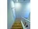 Ascending stairway with carpeted steps and a white railing offers a view of the upper floor at 20 Barbara Ln # 47, Las Vegas, NV 89183