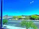 Scenic neighborhood view from the window, showcasing desert landscaping at 20 Barbara Ln # 47, Las Vegas, NV 89183