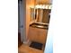 Bathroom features a mirror with lights and a vanity with a black countertop at 220 E Flamingo Rd # 104, Las Vegas, NV 89169