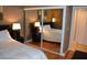 Bedroom featuring a closet with mirrored doors, providing space and brightness at 220 E Flamingo Rd # 104, Las Vegas, NV 89169