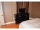 Bedroom with dresser featuring a dark wood finish and a window at 220 E Flamingo Rd # 104, Las Vegas, NV 89169