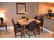 Cozy dining area with seating for five and a view of the kitchen at 220 E Flamingo Rd # 104, Las Vegas, NV 89169