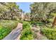 Landscaped pathway with colorful flowers and lush greenery at The Meridian at 220 E Flamingo Rd # 104, Las Vegas, NV 89169