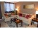 Bright living room featuring stylish sofas, throw pillows, and modern decor at 220 E Flamingo Rd # 104, Las Vegas, NV 89169
