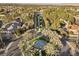 Scenic aerial shot of a community with tree-lined streets and a central water feature at 2337 Prometheus Ct, Henderson, NV 89074