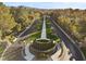Impressive community entrance featuring meticulously landscaped grounds and mature trees at 2337 Prometheus Ct, Henderson, NV 89074