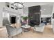 Open-concept living area with contemporary furnishings, a statement chandelier, and abundant natural light at 2337 Prometheus Ct, Henderson, NV 89074