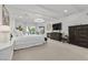 Bright main bedroom with a fireplace, modern lighting, and comfortable furnishings at 2337 Prometheus Ct, Henderson, NV 89074