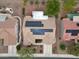 Overhead view of home featuring a tile roof, solar panels, desert landscaping and a cozy backyard at 2512 Desert Glen Dr, Las Vegas, NV 89134