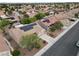Home with solar panels and well-maintained landscaping in a quiet neighborhood; aerial view at 2512 Desert Glen Dr, Las Vegas, NV 89134