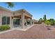 Attractive backyard with a covered patio, slider door, and easy desert landscape, ideal for outdoor living at 2512 Desert Glen Dr, Las Vegas, NV 89134