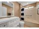 Bright bathroom with modern vanity and a shower-tub combo, offering convenience at 2512 Desert Glen Dr, Las Vegas, NV 89134