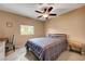 Bedroom with ceiling fan, desk, and window that provides natural light at 2512 Desert Glen Dr, Las Vegas, NV 89134