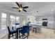 Sunlit dining area with modern table setting and kitchen access at 2512 Desert Glen Dr, Las Vegas, NV 89134