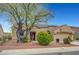 Charming single-story home with a tiled roof and solar panels plus low maintenance xeriscaped front yard at 2512 Desert Glen Dr, Las Vegas, NV 89134