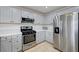 Updated kitchen with stainless steel appliances, gas range, and ample cabinet space at 2512 Desert Glen Dr, Las Vegas, NV 89134