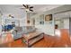 Cozy living room with hardwood floors, comfortable seating, and open access to the kitchen at 2512 Desert Glen Dr, Las Vegas, NV 89134
