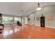 Spacious living area with hardwood floors, large windows, and comfortable furnishings at 2512 Desert Glen Dr, Las Vegas, NV 89134