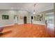 Open-concept living room featuring hardwood floors, ample space, and neutral decor at 2512 Desert Glen Dr, Las Vegas, NV 89134