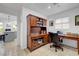 A beautiful office with wood furnishing, open to the kitchen at 2512 Desert Glen Dr, Las Vegas, NV 89134