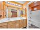 Bathroom with double sink vanity, bright lighting, and shower/tub combination at 2707 Commitment Ct, North Las Vegas, NV 89031