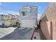 Two-story home with a two-car garage and a tidy, low-maintenance front yard at 2707 Commitment Ct, North Las Vegas, NV 89031