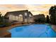 The backyard features a pool, patio and green space for relaxing and entertaining at 2714 Cricket Hollow Ct, Henderson, NV 89074