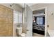 Attached bathroom featuring a tiled shower, toilet, and access to the main bedroom at 2714 Cricket Hollow Ct, Henderson, NV 89074