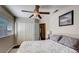 Bedroom featuring a ceiling fan, window, and closet at 2714 Cricket Hollow Ct, Henderson, NV 89074