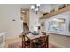 Cozy dining room featuring a wooden table and staircase access at 2714 Cricket Hollow Ct, Henderson, NV 89074