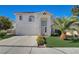 Two-story home featuring an attached garage, well-kept lawn, and lovely curb appeal at 2714 Cricket Hollow Ct, Henderson, NV 89074