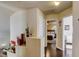 Hallway with hardwood floors and views into multiple bedrooms at 2714 Cricket Hollow Ct, Henderson, NV 89074