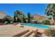 Inviting backyard pool with lounge chairs and lush landscaping providing a private oasis at 2714 Cricket Hollow Ct, Henderson, NV 89074