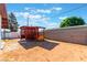 This backyard includes a covered pergola, offering shade and outdoor relaxation at 2825 Hickey Ave, North Las Vegas, NV 89030