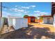 Backyard featuring a shed and a pergola, providing storage and outdoor living options at 2825 Hickey Ave, North Las Vegas, NV 89030