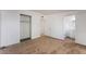 Bedroom with a carpet, a closet with white sliding doors, and an ensuite bathroom with a sink and toilet at 2825 Hickey Ave, North Las Vegas, NV 89030
