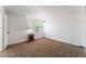 Cozy bedroom with neutral walls, carpet, and natural light from a window at 2825 Hickey Ave, North Las Vegas, NV 89030